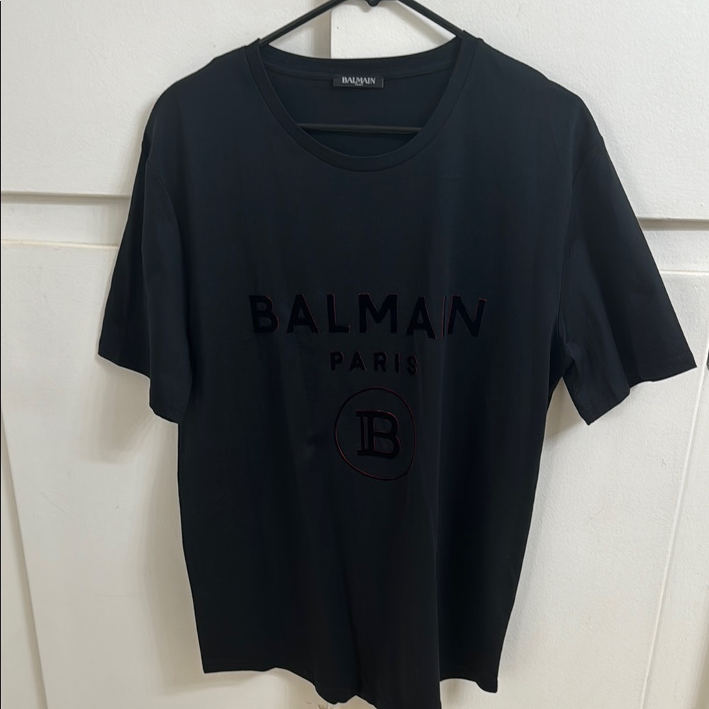 Original Balmain Paris men t-shirt size extra large. Black with red outlining.
